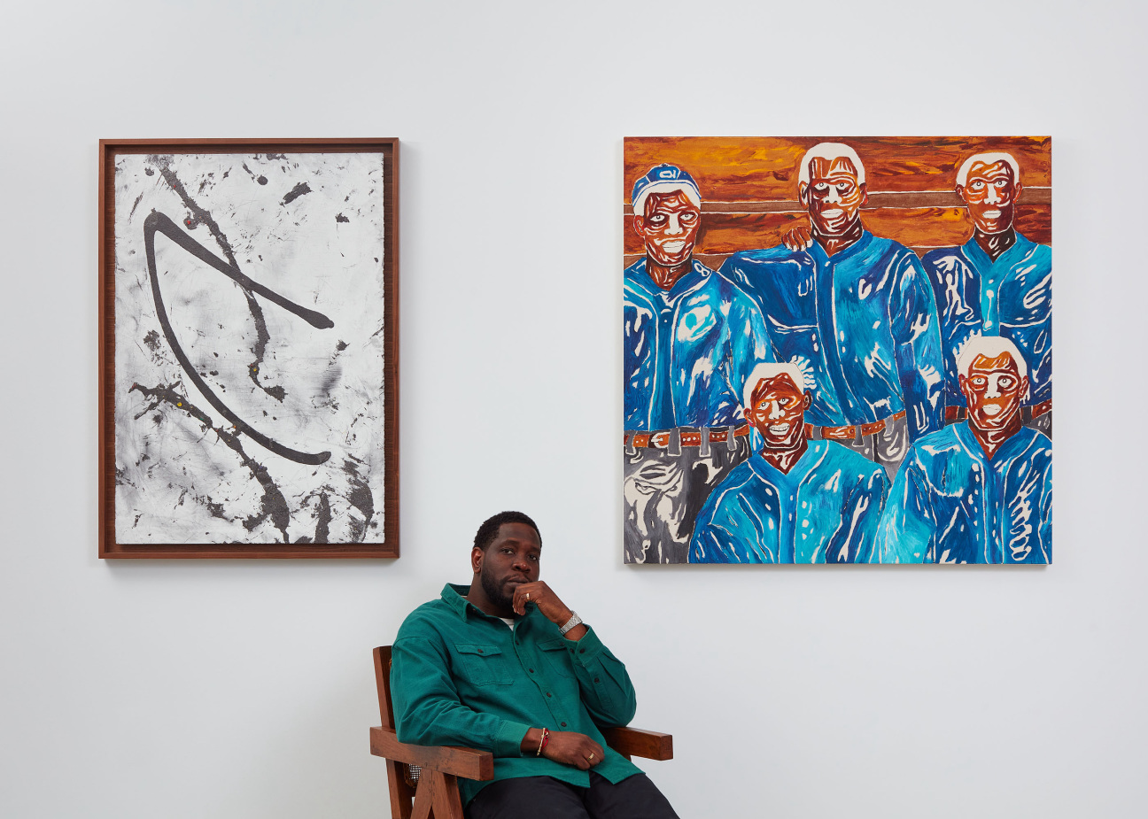 Portrait of Easy Otabor sitting in Chair at Anthony Gallery in Chicago, IL.